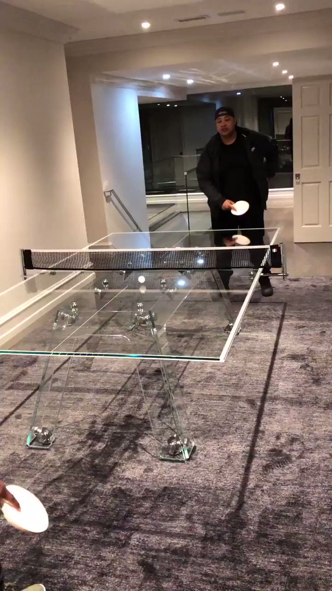 Fooling around, playing my cousin Roy on my $30,000 crystal glass ping pong table. https://t.co/9nUtlyEnYd