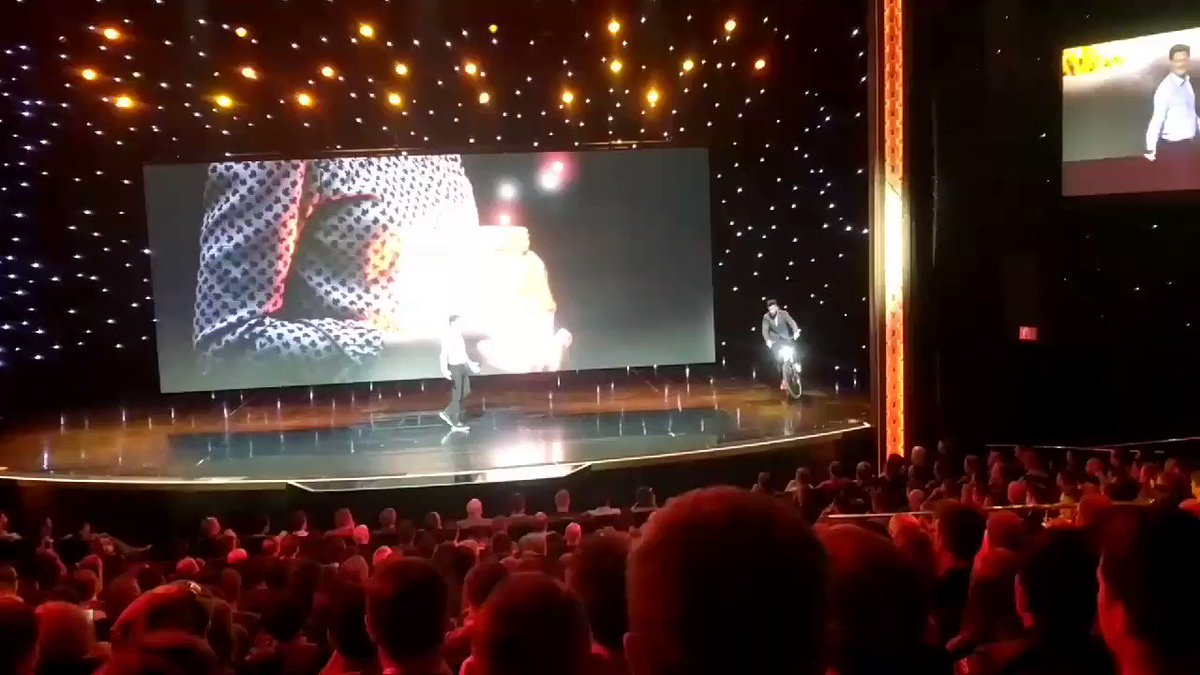 kalenjordan: Seemed a good a time as any for @philwinkle to ride onto stage with a bike. #MagentoImagine https://t.co/zoA7Boysqr