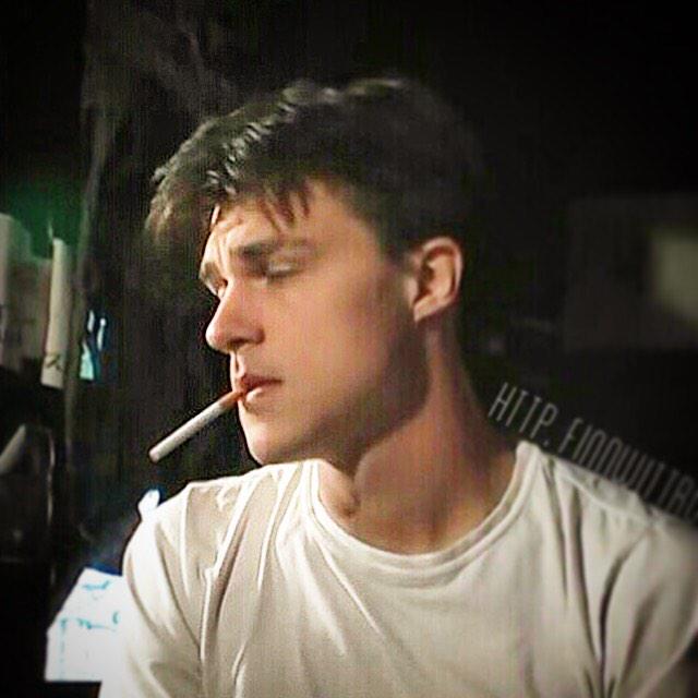Finn Wittrock smoking a cigarette (or weed)
