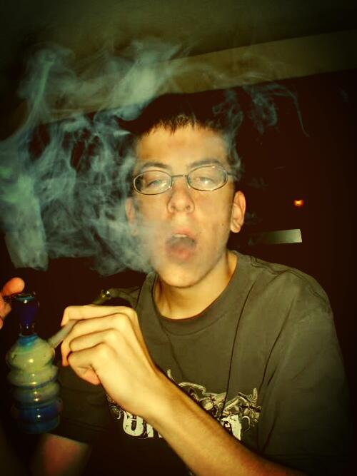 Christopher Mintz-Plasse smoking a cigarette (or weed)
