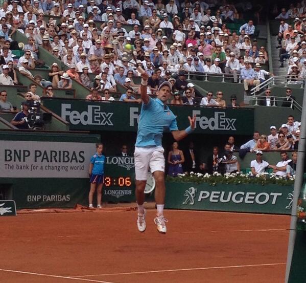 Djokovic jumps to return a shot [via @RolandGarros]