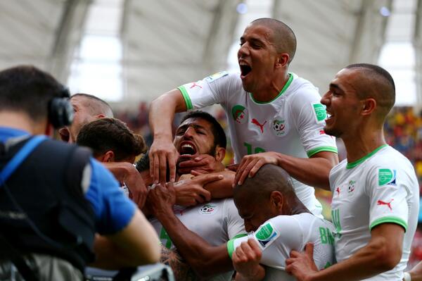 Algeria players celebrate a goal [via FIFA.com]
