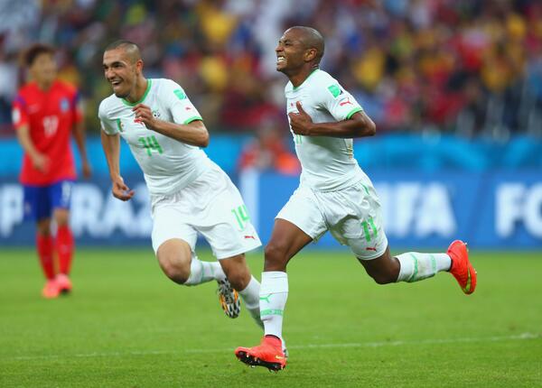 Brahimi celebrates Algeria's fourth with teammate [via FIFA.com]