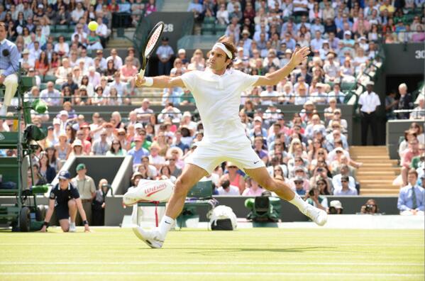 Federer returns a shot [via @wimbledon]
