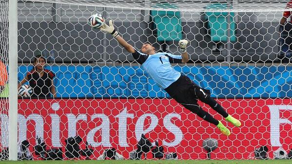 Keylor Navas at full stretch to make a save [via FIFA.com]