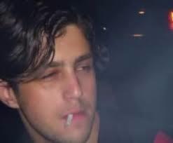 Josh Peck smoking a cigarette (or weed)

