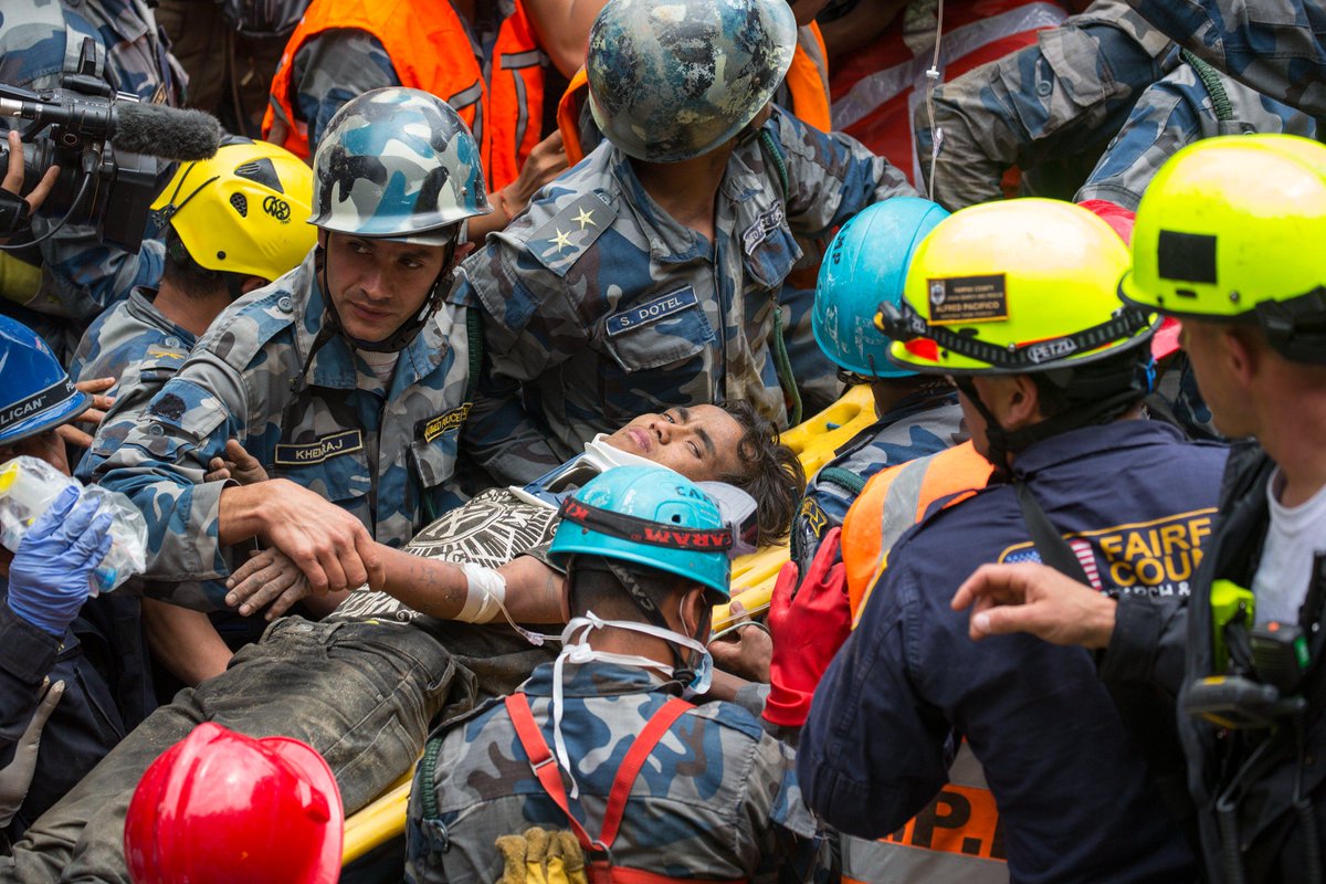 Rescue crew pulls survivor from rubble days after nepal quake.