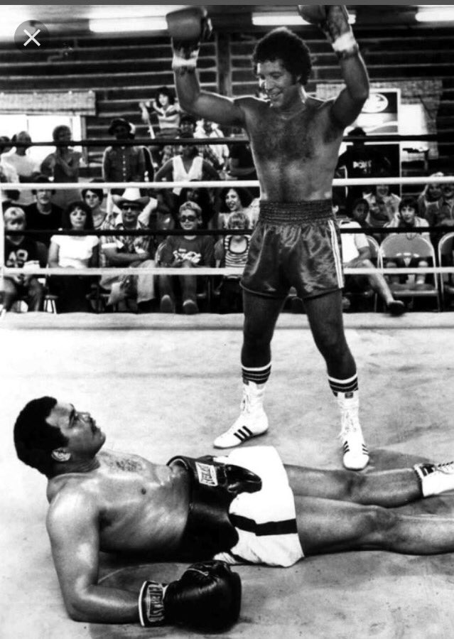Tom Jones , in the ring as a publicity gag , Ali hits the deck and whispers 