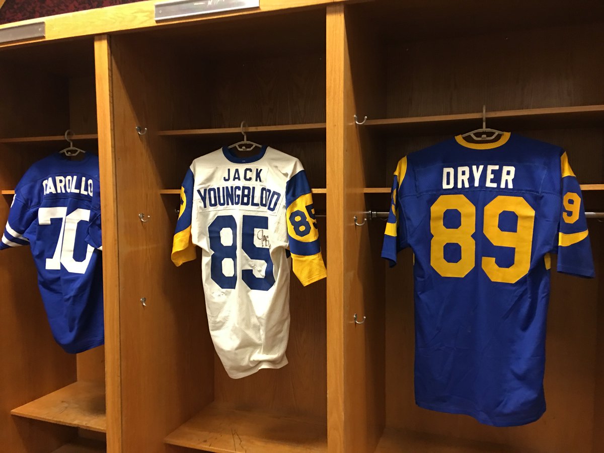 Old la rams jerseys are hanging up inside the home locker room at the