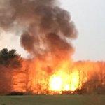 Large flames shoot from abandoned home in Clinton County