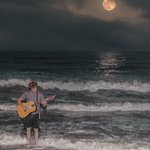 Photographer seeks identity of mystery musician captured performing by moonlight Photographer seeks identity of mystery musician captured performing by moonlight