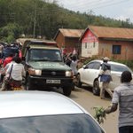 Traders go about business, despite riot cops’ presence