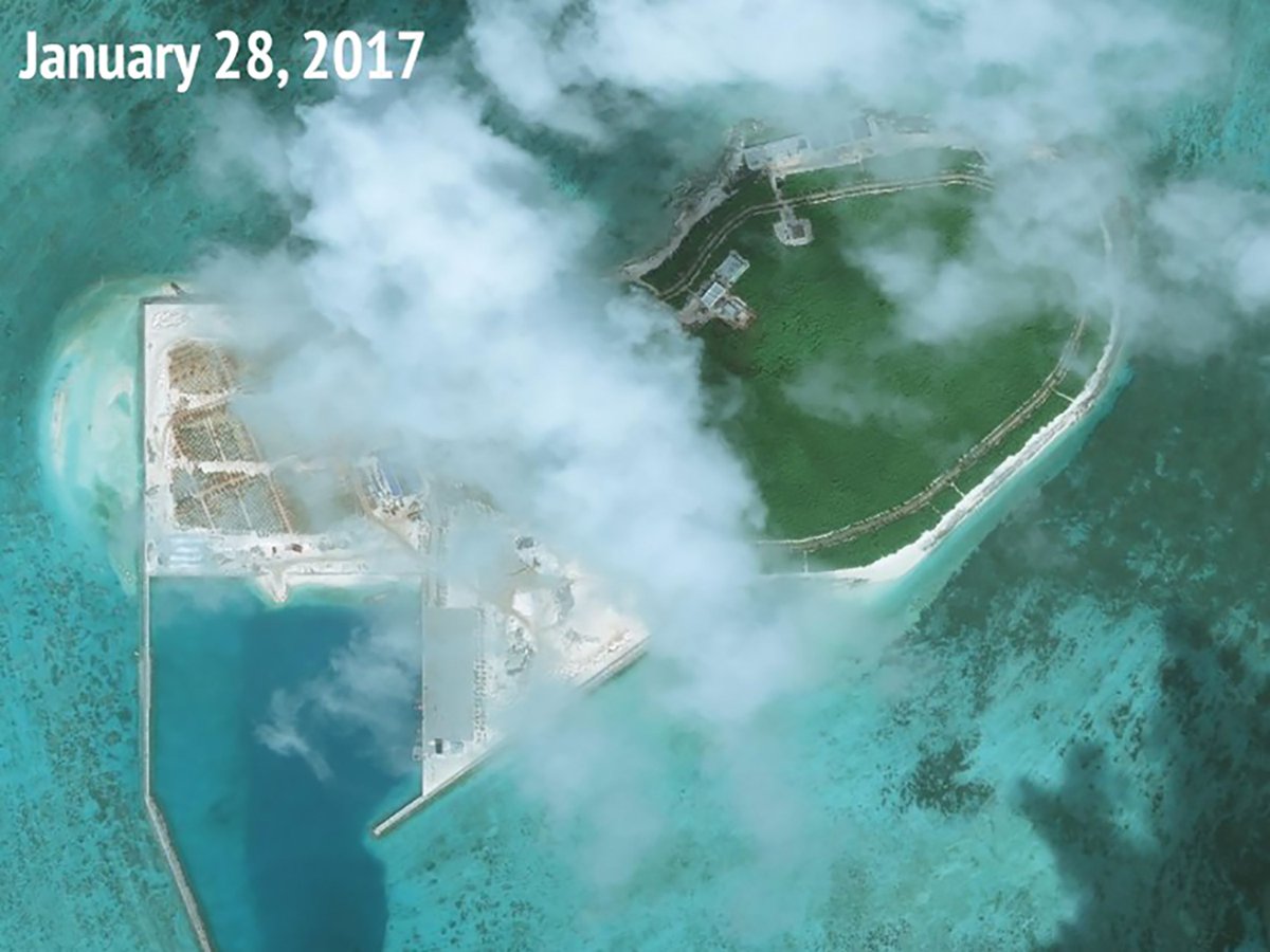 US warship sails near disputed islands in South China Sea, say US officials