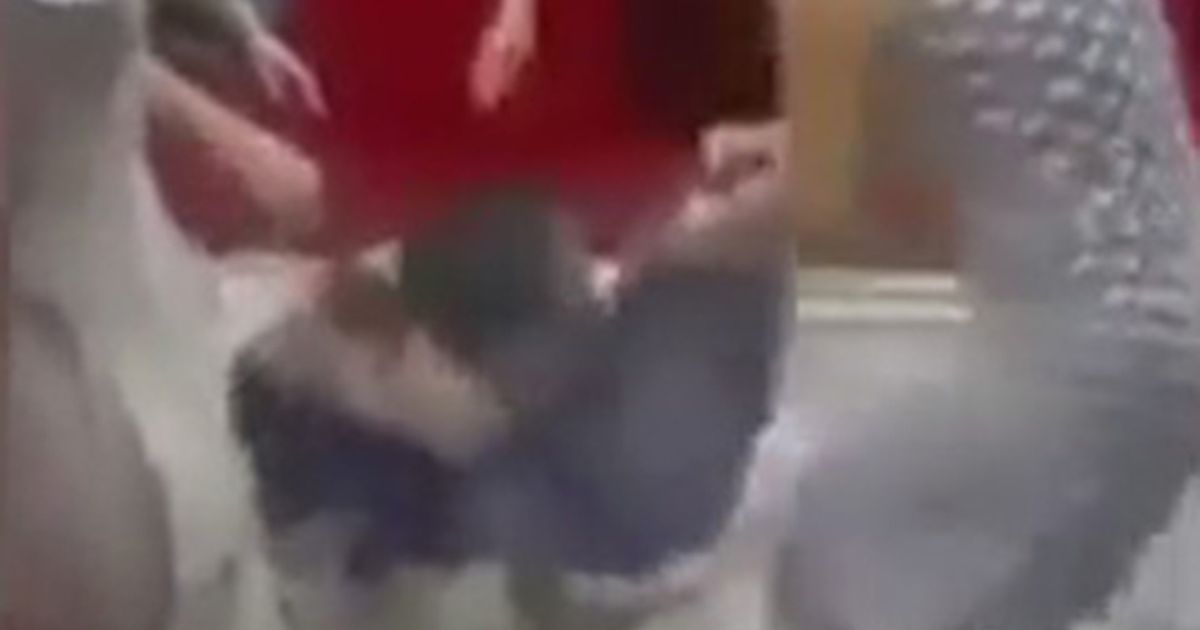 Woman accused of shoplifting at fashion store is stripped topless, kicked and thrown out into the street