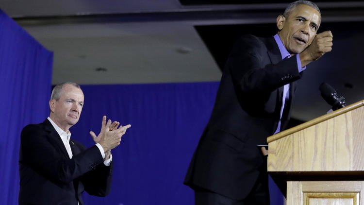 Obama, campaigning in 2 states, tells Democrats to reject politics of division, fear