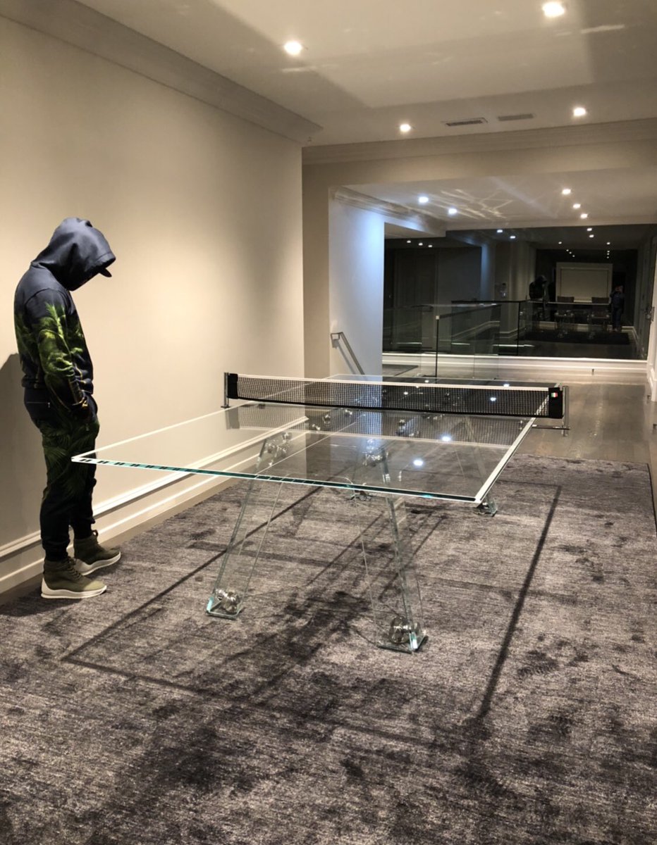 Fooling around, playing my cousin Roy on my $30,000 crystal glass ping pong table. https://t.co/2PN9VbnQhI