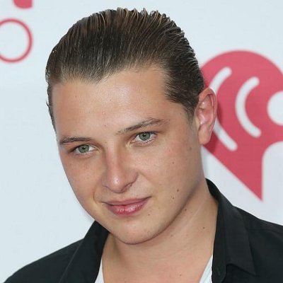The 33-year old son of father (?) and mother Jackie John Newman in 2024 photo. John Newman earned a  million dollar salary - leaving the net worth at 3 million in 2024