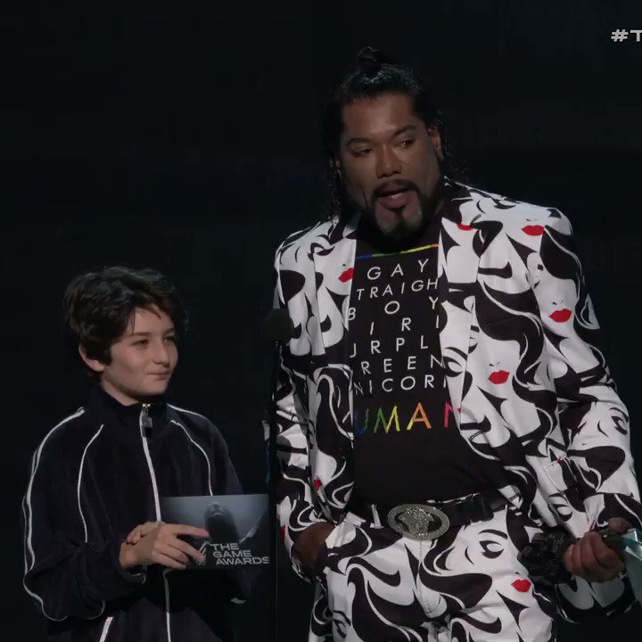 LOS ANGELES - DECEMBER 6: Presenters Sunny Sulijic and Christopher Judge  appear onstage at the 2018 Game Awards at the Microsoft Theater on December  6, 2018 in Los Angeles, California. (Photo by