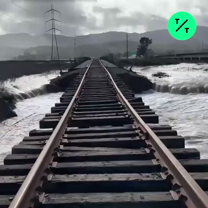 A California storm has broken a levee and damaged railroad tracks