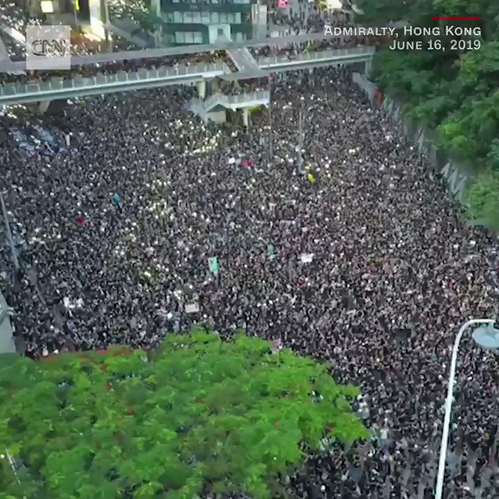 In Hong Kong, aerial footage shows thousands of protesters marching in opposition to a controversial extradition bill. Many are dressed in black and wearing white ribbons on their chests: https://cnn.it/2XOpjrH