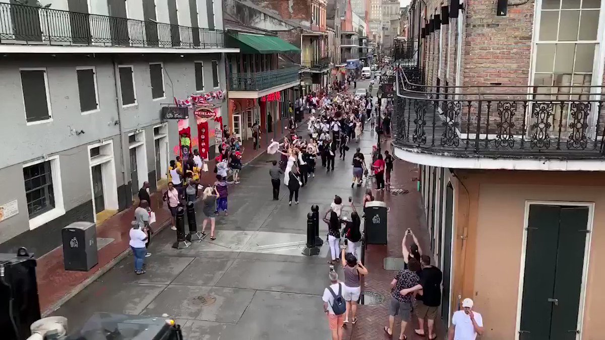 Love can weather any storm! Tropical Storm Barry didn't stop these newlyweds from second-lining through the French Quarter!