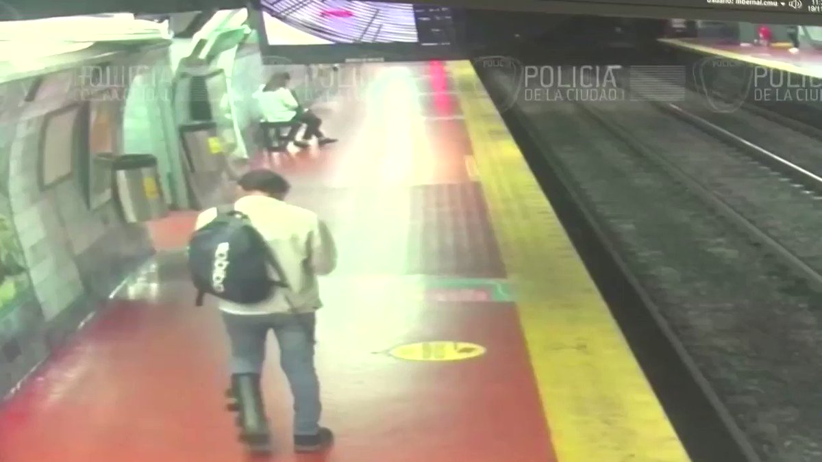 Image result for A subway commuter distracted by his cell phone has a close call on the subway tracks
