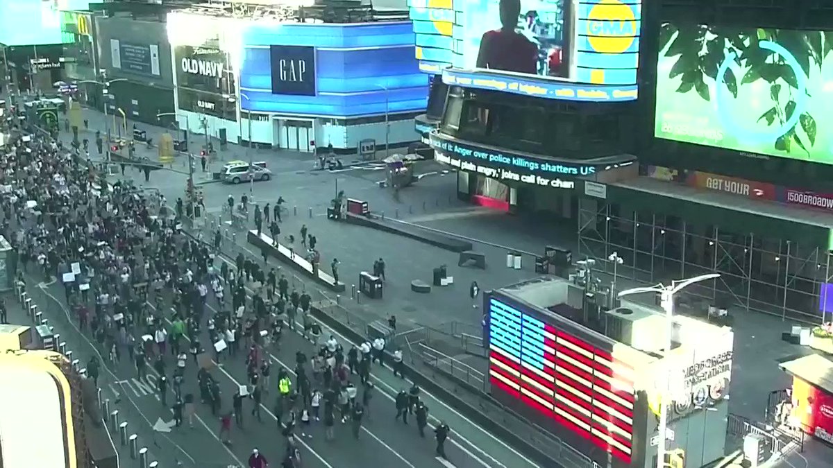 Protesters take a knee during a peaceful demonstration in Times Square in New York. Follow live updates: https://t.co/tE6sggbi2U https://t.co/3d9Ky56nnV