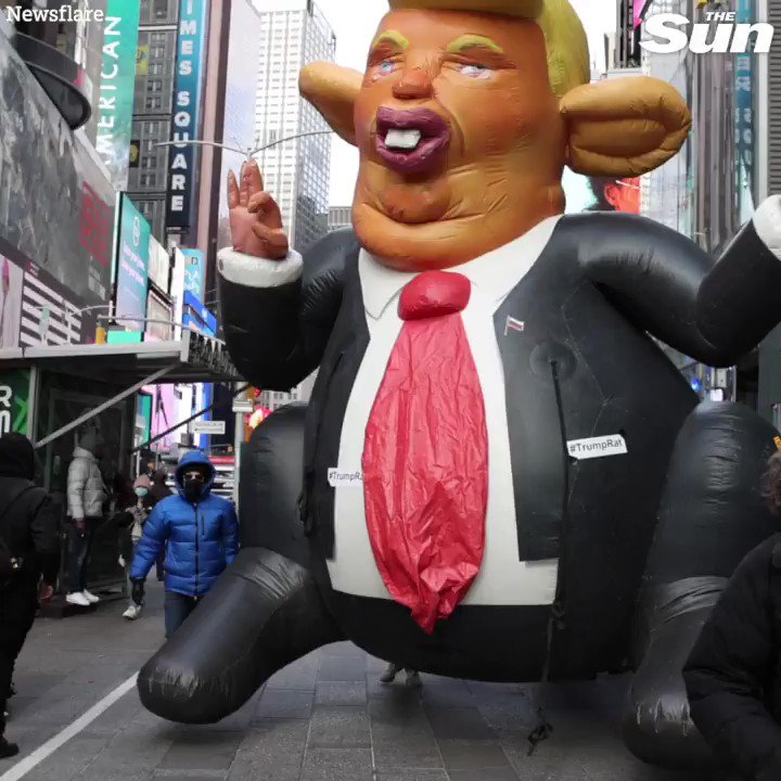Giant inflatable Donald Trump 'rat' carried through New York's Times Square