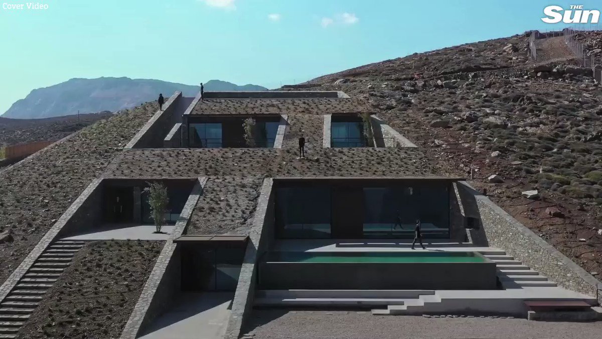 Futuristic home built into a Greek cliff looks like a James Bond villain's lair