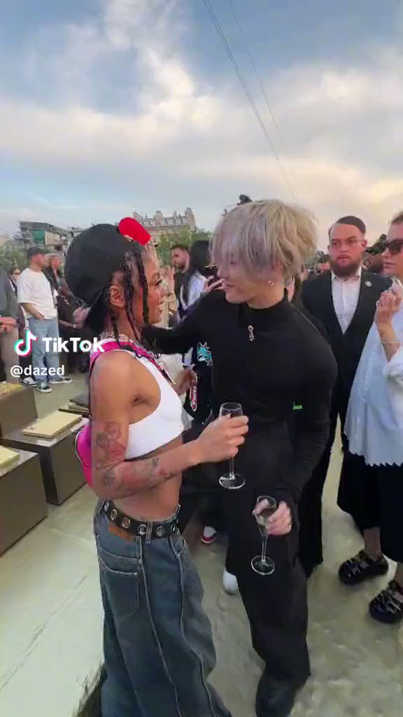 Buzzing Pop on X: Jackson Wang and Coi Leray interacting at the Louis  Vuitton fashion show.  / X