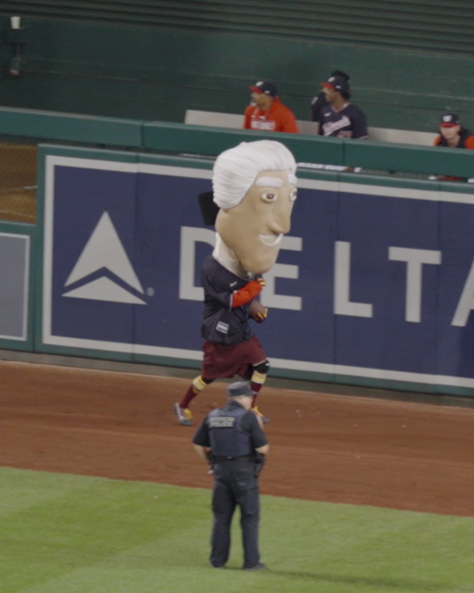 WASHINGTON, DC - APRIL 29: The Nationals bald eagle Mascot Screech dances  in his Cherry Blossom City Connect jersey and fedora hat during the  Pittsburgh Pirates versus Washington Nationals MLB game 2