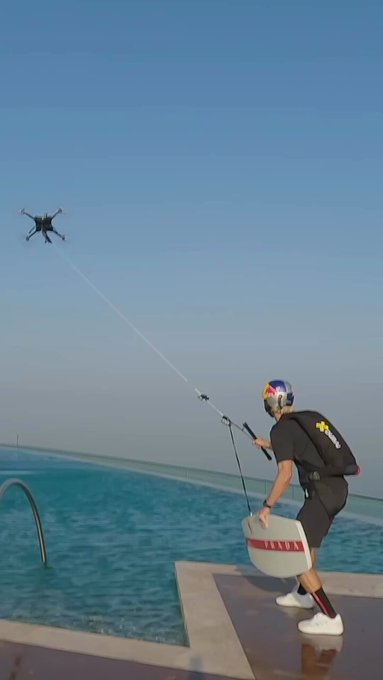 briankgrubb just made history by doing the first-ever wakeskate BASE jump, powered by PradaLineaRossa