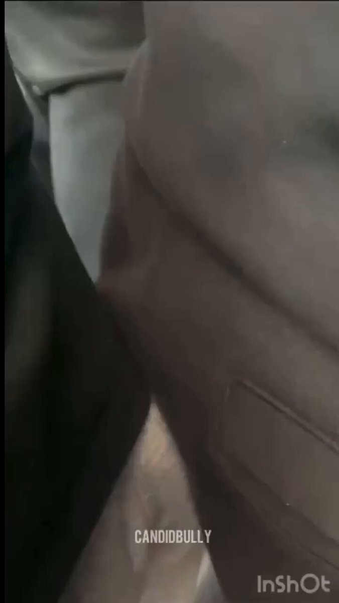 A woman in a bright outfit walks away showcasing her figure