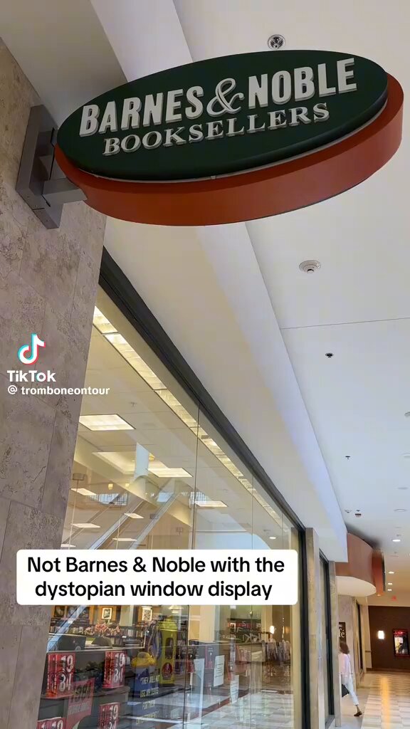 Barnes & Noble's dystopian window display featuring books like 1984 and The Handmaid's Tale