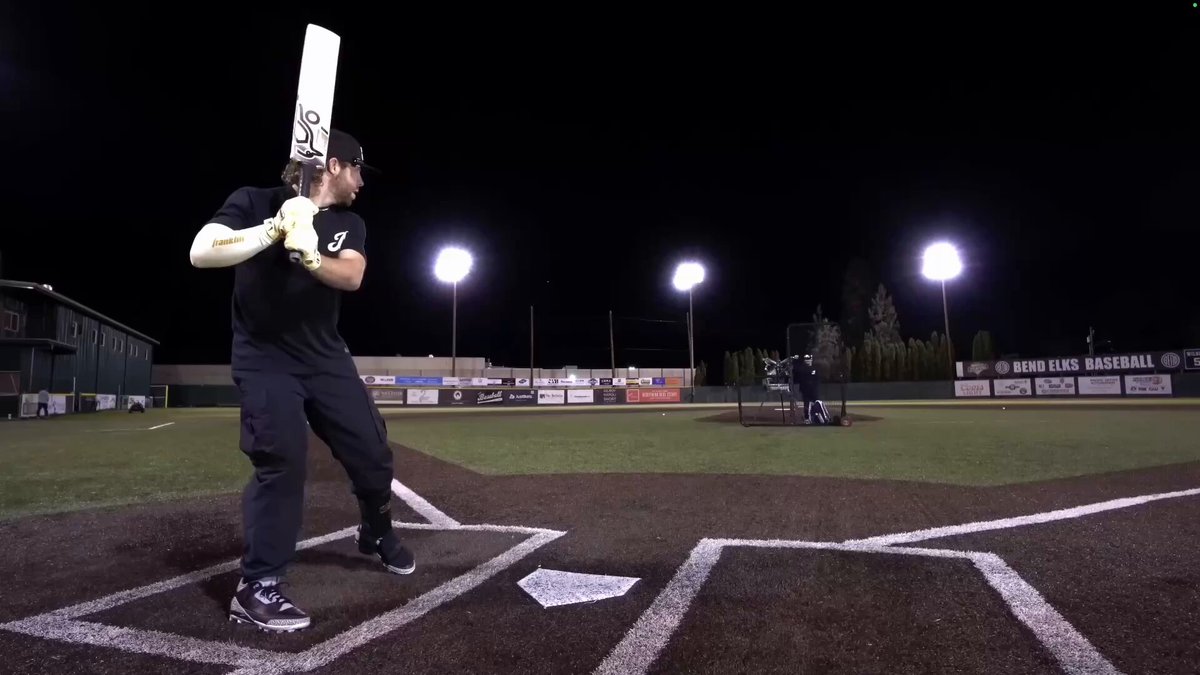 Baseball dude tries cricket bat Picture