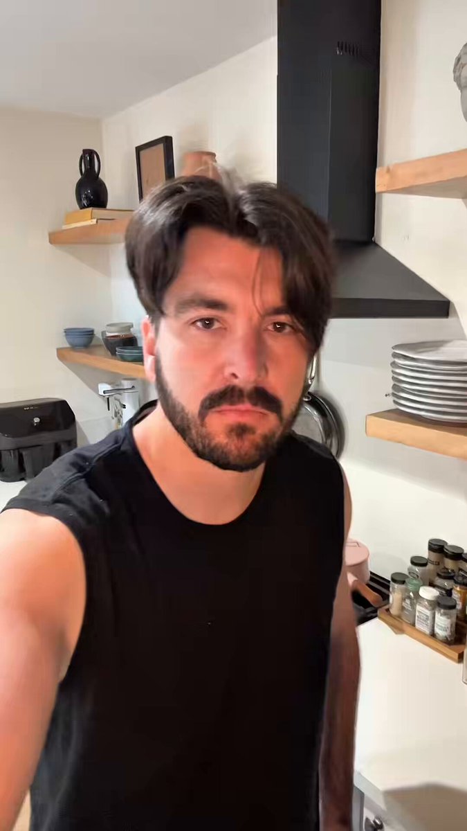 Drew Coffman in his kitchen, discussing content coins