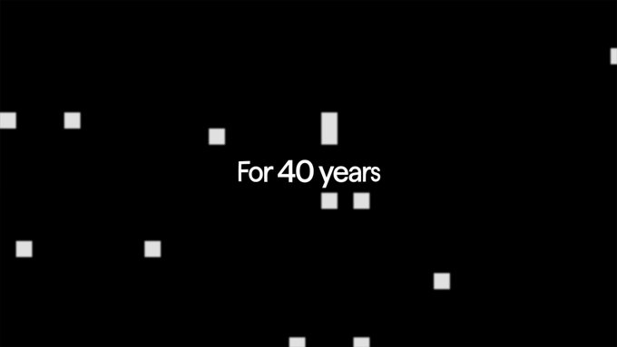 A minimalist black background with scattered small white rectangles resembling file icons or folders, and bold white centered text reading 'For 40 years' in a modern sans-serif font, evoking stagnation in file management interfaces.