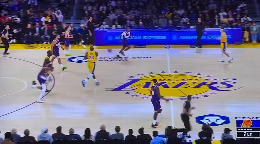 JJ got really upset that the refs didn't call an over and back call on Dillon Brooks. But if we look closely, we'll see that after the ball was established in front court by Gillespie, all Brooks needs to do is get one foot down in front court and other foot off the floor. 