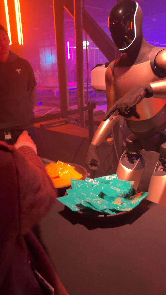 Optimus V2.5 waves at xAI event