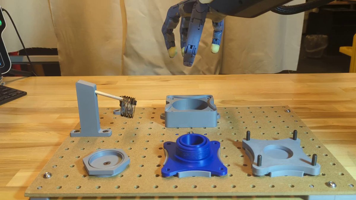 Robotic arm assembling electronics