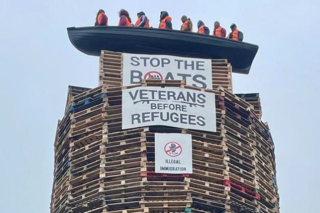 BenGilroyIRL's tweet card. The placing of an effigy of a migrant boat on a loyalist bonfire in Co Tyrone is being investigated as a “hate incident”, the PSNI has confirmed.