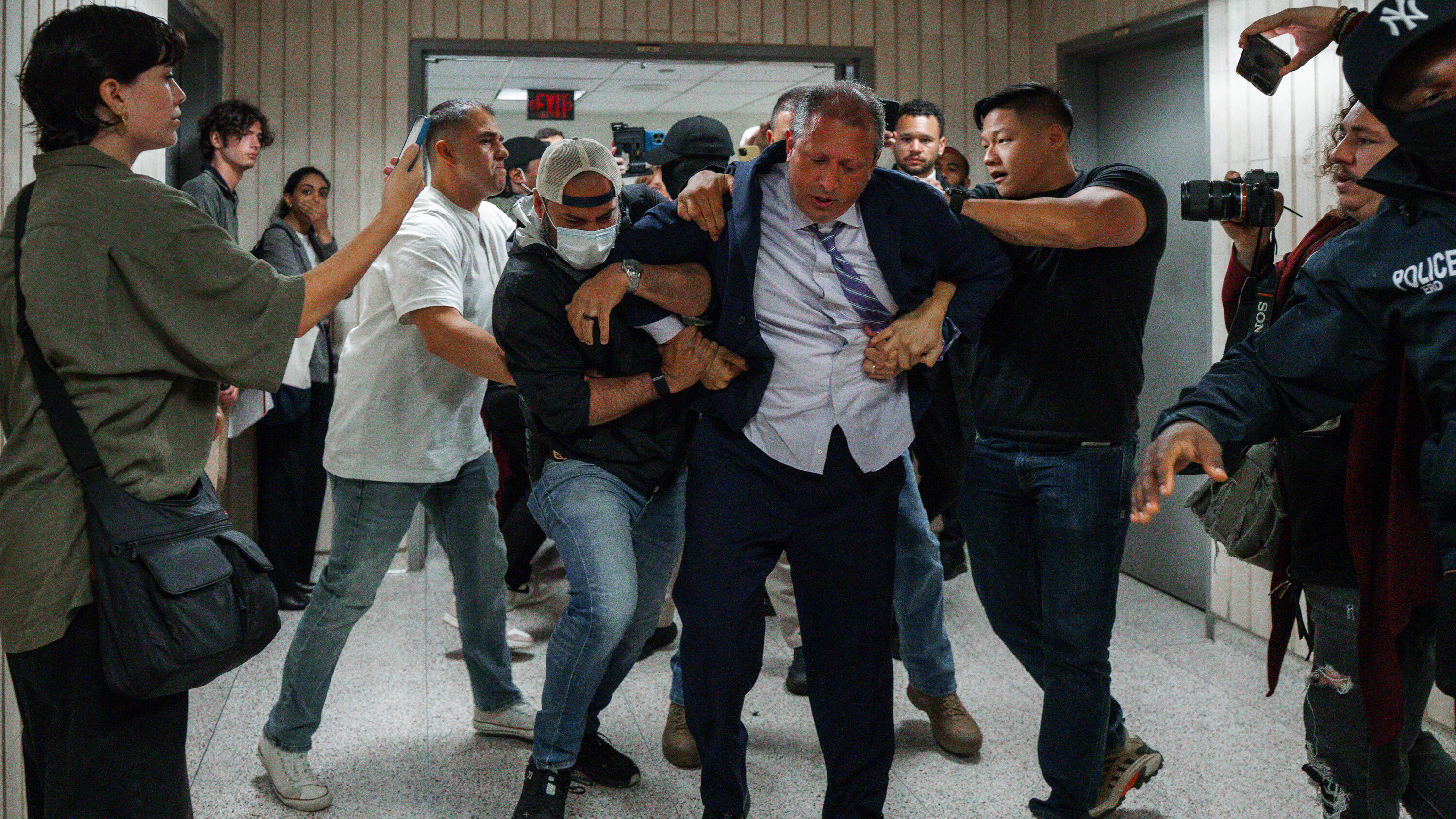 luisferre's tweet card. Mr. Lander, the New York City comptroller and a candidate for mayor, was handcuffed as he tried to steer a man past Immigration and Customs Enforcement officers.
