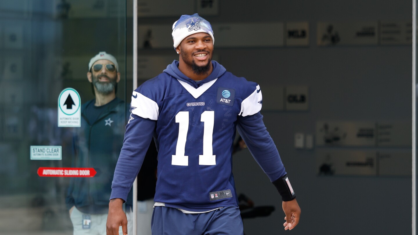 ProFootballTalk's tweet card. The Cowboys edge rusher is in training camp despite not having a contract extension yet.