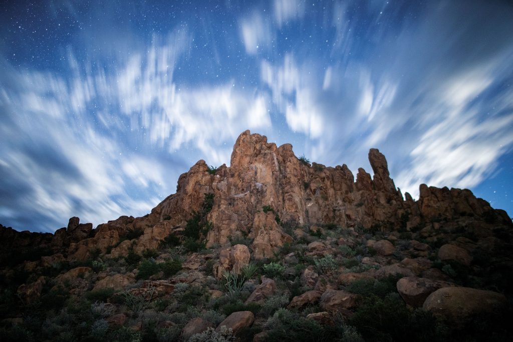 sundaylongread's tweet card. A writer contemplates whether the skies really are bigger in Texas alongside photos from across the state who sought to capture the sky.