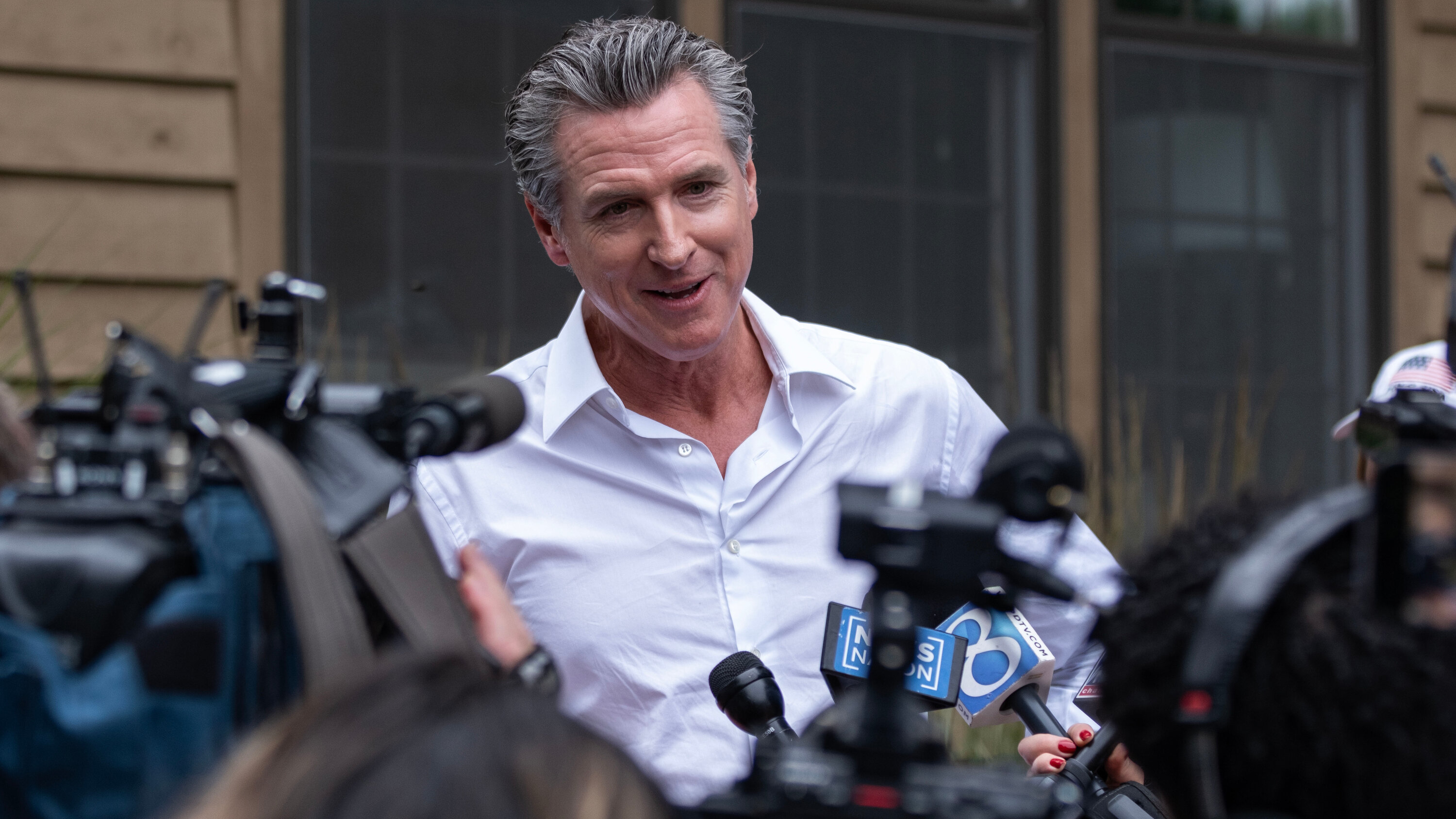 KateMishkin's tweet card. The California governor was working out on a treadmill when he got the news that President Biden was ending his campaign.
