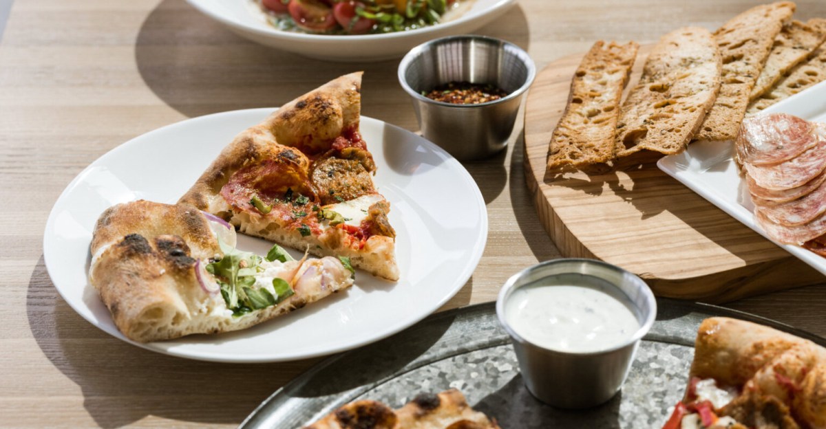 EaterCarolinas's tweet card. From New York slices to Italian pies, Asheville offers a range of pizzas