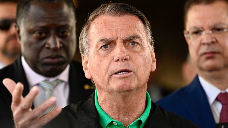 cnni's tweet card. Police in Brazil swooped on the home and political headquarters of former President Jair Bolsonaro early Friday, searching the properties, ordering him to wear an electronic ankle tag and barring him...