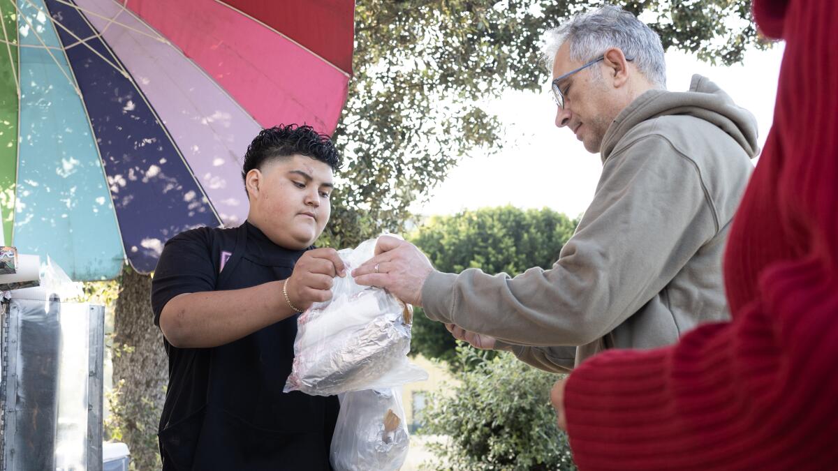 grace_2e's tweet card. Chris Garcia began selling tamales on behalf of his mother, a legal resident who was caught up in an immigration sweep two weeks ago at Villa Parke in Pasadena.