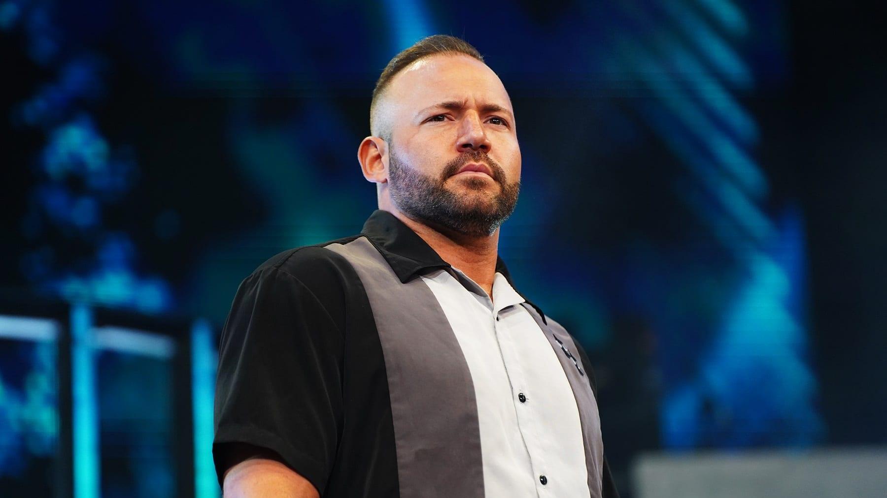 Ultimate_One1's tweet card. QT Marshall shares his thoughts on why AEW is running smaller venues and market residencies, noting improved crowd energy and atmosphere.
