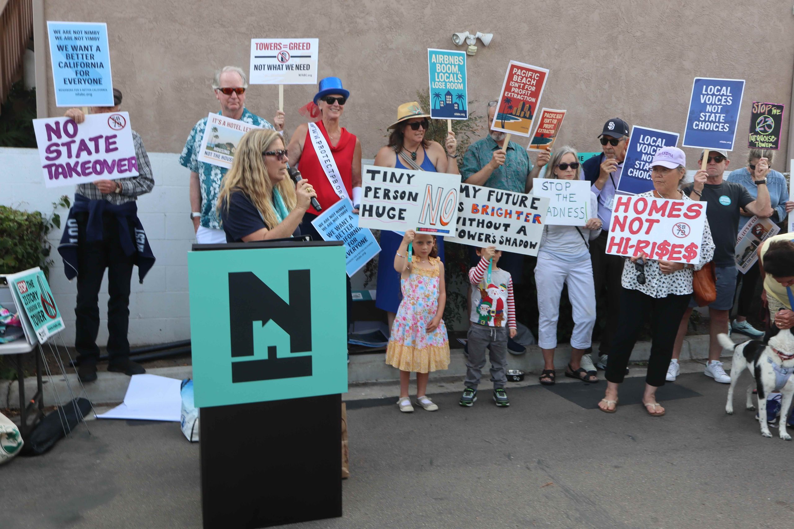 paulkruegersd's tweet card. The NFABC rally featured recorded music and civic leaders with bullhorns exhorting the crowd to protest increasing density and high rises.